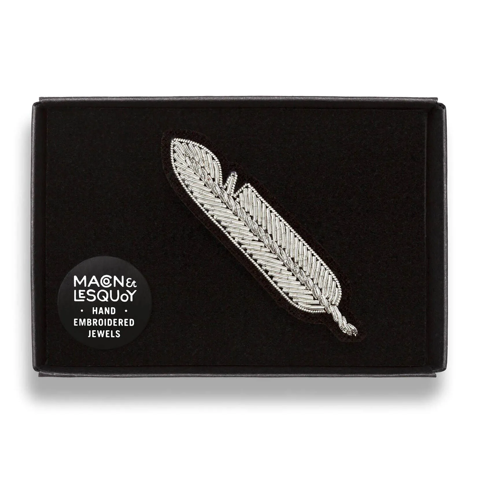 Small silver feather brooch